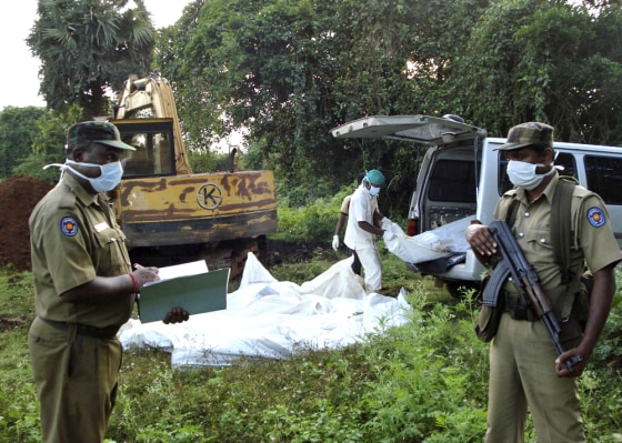 Image: health worker unloads the bodies of Liberation Tiger
