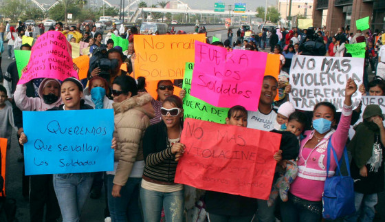 Image: Protesters block a main avenue during a demonstration against the Mexican army in Monterrey