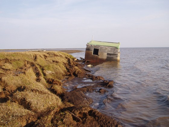This cabin along Alaska's Arctic coastline was recently washed into the ocean when the bluff eroded away. 