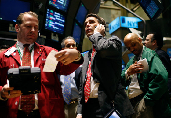 Traders at station trading Citigroup stock on floor of New York Stock Exchange