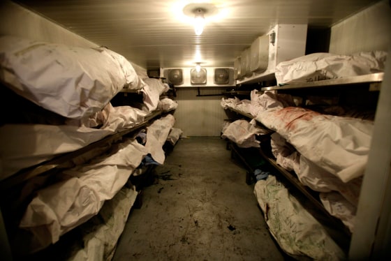 Bodies awaiting autopsies crowd a walk-in refrigerator at the morgue in the border city of Ciudad Juarez, Mexico.