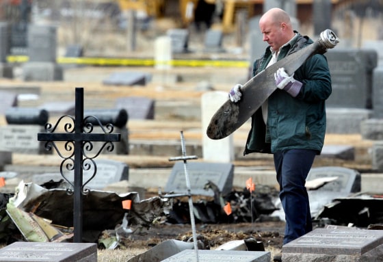 Image: NTSB investigators scour Holy Cross Cemetary