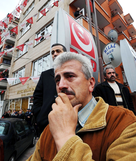 Image: Party members waits outside the party headquarters