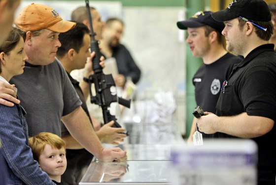 Image: Customers line up to look at firearms at a gun shop in Fort Worth, Texas