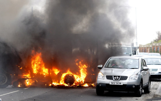 Image: hi-jacked vehicles set on fire