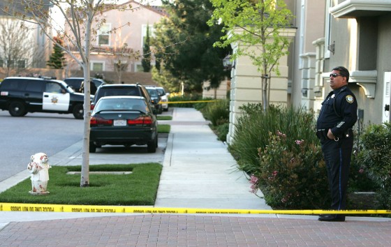 Image: Santa Clara police officer stand watch outside the crime scene