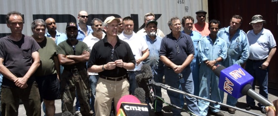 Image: Crew members of the American container ship Maersk Alabama speak to the media
