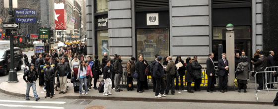 Image: People queue for a job fair in New York