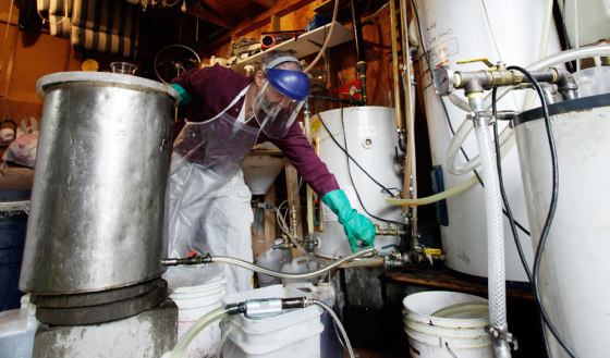 Lyle Rudensey refines homemade biodiesel from used cooking oil in his garage Wednesday in Seattle.