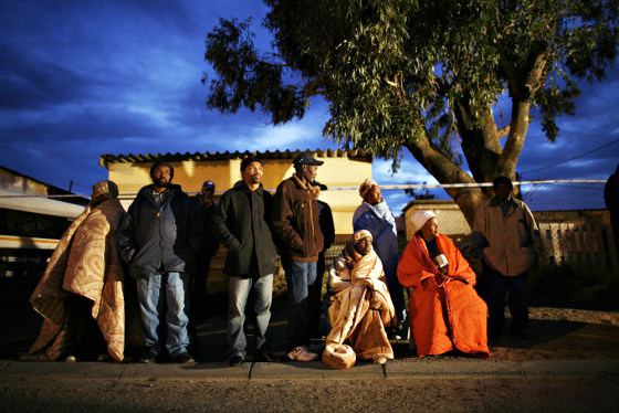 Image: South Africans wait for a polling station to open in Cape Town's Khayelitsha township