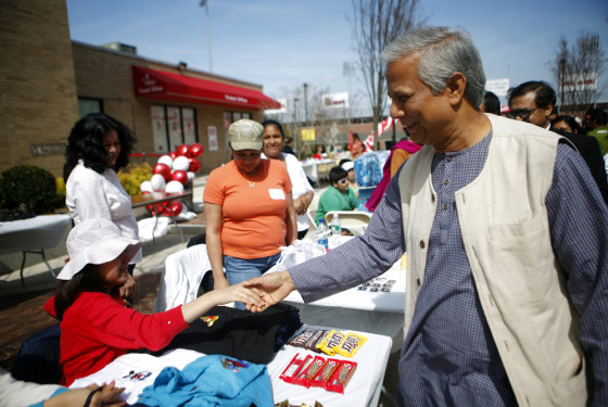 Image: Nobel Peace Prize winner Muhammad Yunus greets borrowers at a Granmeen America open house at St. John's University in New York