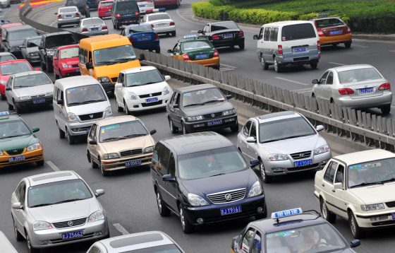 Presumably, Chinese-made cars such as this Buick blue minivan in Beijing traffic, would enable GM to cut costs, and in the hyper-competitive global auto world of crippling labor costs and shrinking profit margins, any advantage counts.