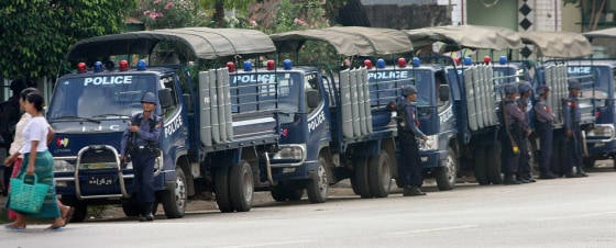 Image: Police trucks line a street in Myanmar's largest city Yangon