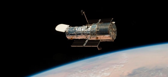 Image: Shuttle mission astronauts work on Hubble repairs
