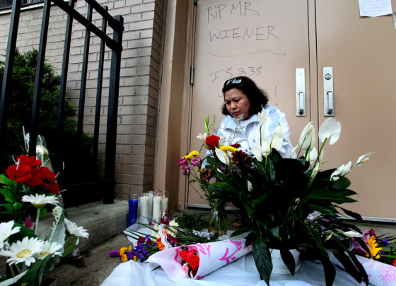 Image: Math teacher Emelinda Mabulay places flowers