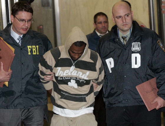 Image: Suspect David Williams is walked out of the FBI offices after being taken into custody in New York