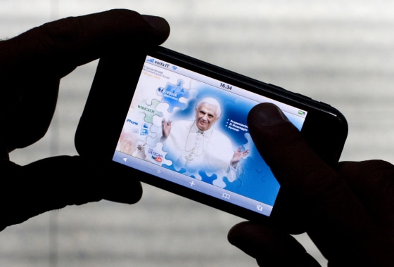 Image: iPod Touch displays official Vatican internet portal with an image of Pope Benedict XVI in Rome