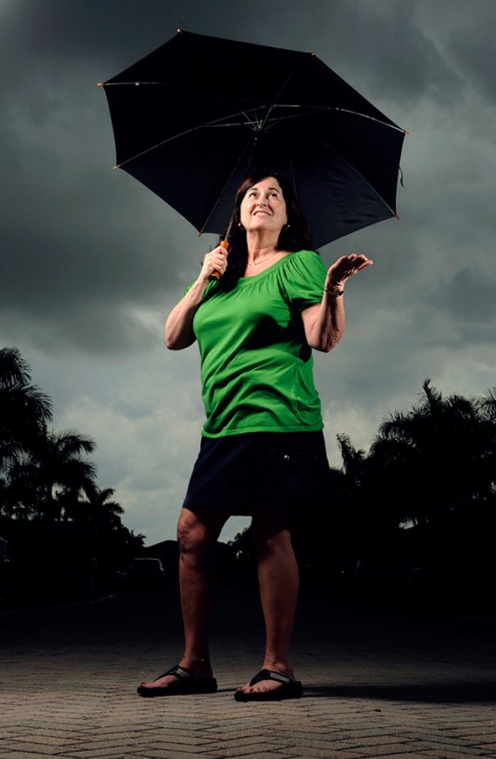 Susan Scibetta of Boynton Beach, Fla., stands ready for a storm at her home on Sunday. Scibetta, who is affectionately called "Chicken Little" by friends and family, is a perfectionist preparer when it comes to hurricane season.