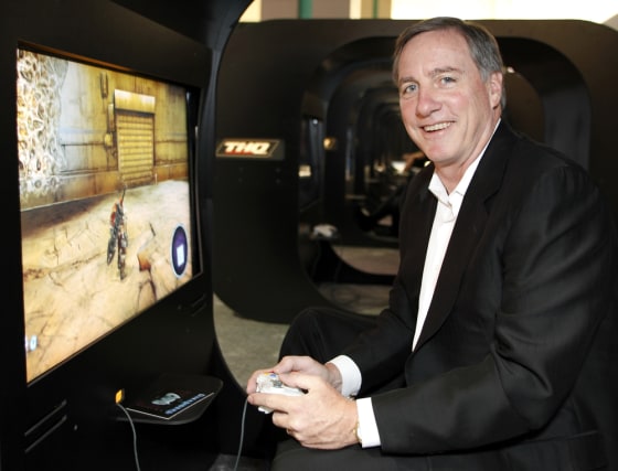 THQ President, Chairman and CEO Farrell poses for a photo in a pod at the THQ booth during the E3 in Los Angeles