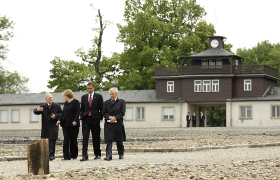 Image: US President Obama and German Chancellor Merkel listen to Holocaust survivors during visit to former Buchenwald Nazi concentration camp