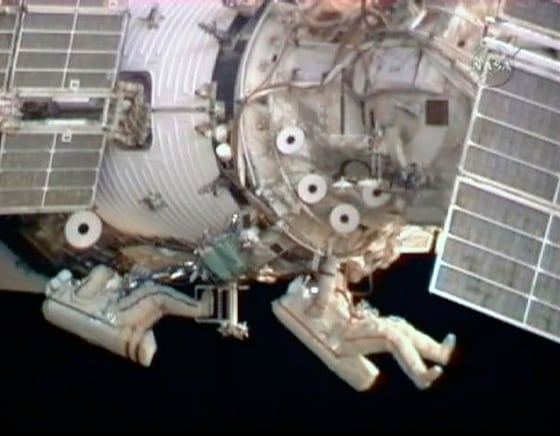 Image: Flight engineer Barratt and Commander Padalka work side by side during their spacewalk from the International Space Station i