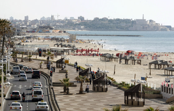 A picture shows Tel Aviv’s sea front promenade on the Israeli Mediterranean coastline earlier this year. In April, Tel Aviv started celebrating its 100th anniversary. The Mediterranean city was founded in 1909 near the ancient Arab port city of Jaffa (background).