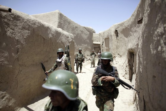 Image: Afghan national army soldiers patrol during special operation at Sanjaray in Kandahar Province