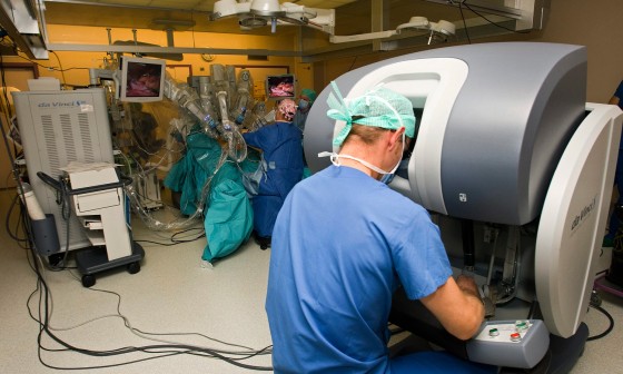 Surgeons use the robot da Vinci to aid a hernia operation, at the University Hospital Geneva, in Geneva, Switzerland, Thursday, Nov. 13, 2008. The surgeons are with the surgical team of Swiss professor Phillipe Morel, head of visceral and transplantation surgery and chairman of the department of surgery of the University Hospital Geneva. The University Hospitals of Geneva (HUG) opened the department for robotic surgery on Thursday, where between 50 and 80 surgeons from around the world will have the possibility to train with the robot da Vinci each year. (AP Photo/Keystone, Salvatore Di Nolfi)