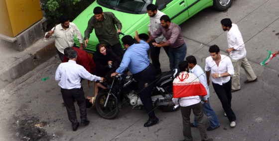 Image: Iranian supporter of Mir Hossein Mousavi is beaten by government security members