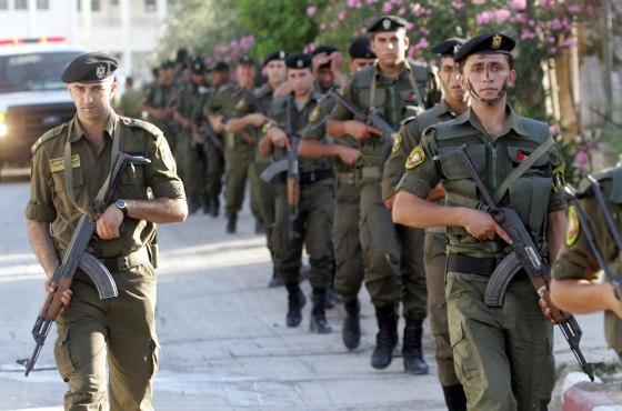 Palestinian security forces patrol the West Bank town of Jenin on June 18.