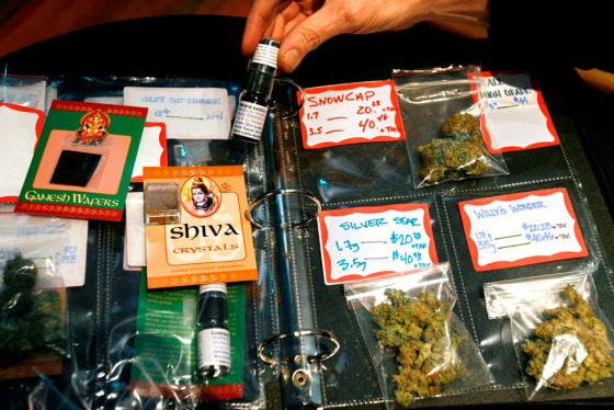 Image: A binder showcasing high-grade marijuana buds at the Coffeeshop Blue Sky dispensary