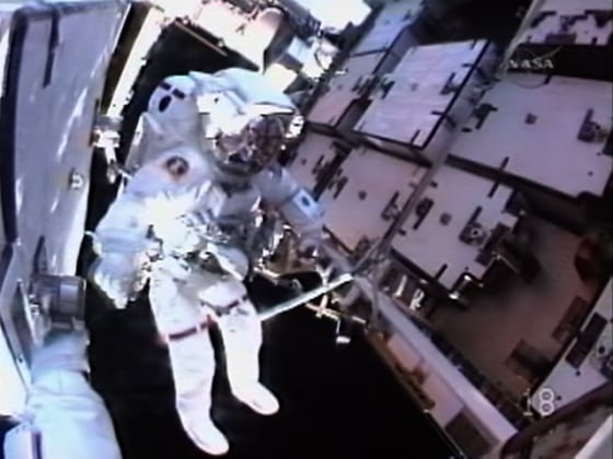 Spacewalker Thomas Marshburn works on the battery replacement job outside the international space station on Friday.