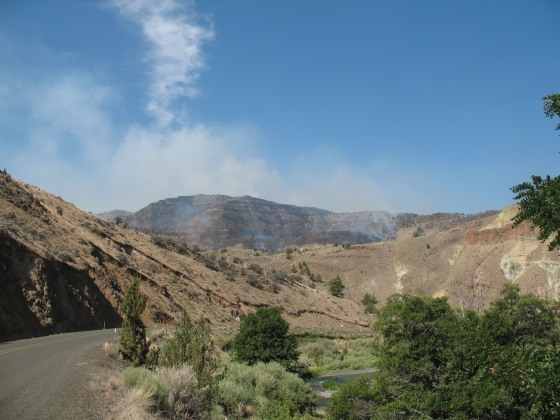 Smoke marks the spot of a small wildfire that started Sunday near Spray, Ore. Much of the state as well as California and Washington are forecast to see a severe wildfire season.