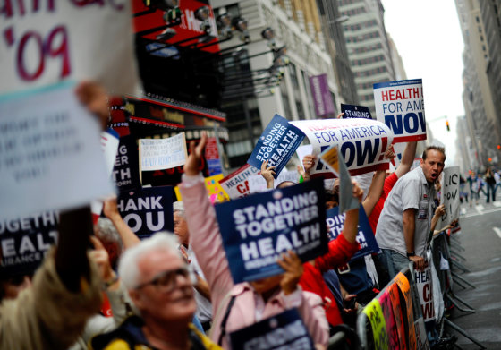Image:  People attend a rally supporting the passage of health care bills