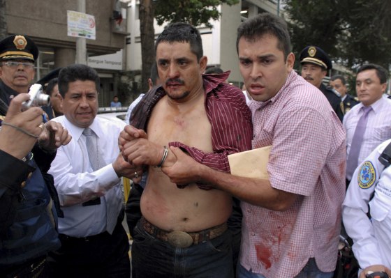 Image: Police arrest a suspected gunman in Mexico City