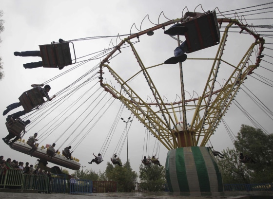Image: Iraqis enjoy the first day of Eid