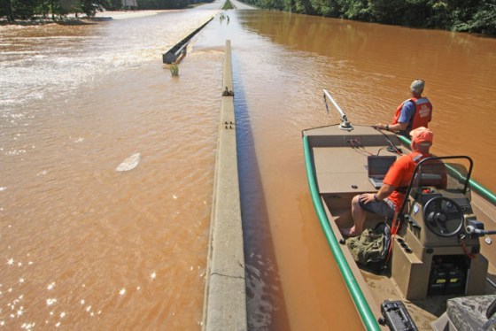 Both lanes of Interstate 20 at Sweetwater Creek near Lithia Springs, Ga., were swamped during the flooding there earlier this week. A U.S. Geological Survey crew measures flood depths and that same day saw someone drive a SUV across the left lane, making it across but nearly being swept away.