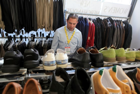 Image: Jose Delgado shops for shoes at a discount clothing store