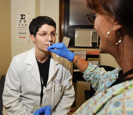 Image: Dr. Tanya Bailey and Marsha Behrens with H1N1 vaccines
