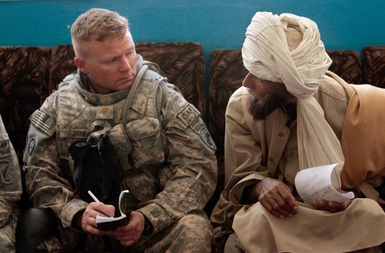Image: Locals meet with U.S. Army