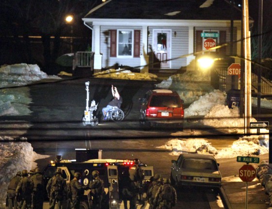 Image: suspect in a wheelchair surrenders