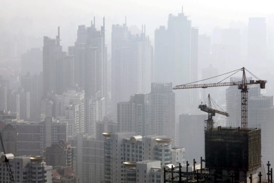 Image: A view of the sky scrapers that crowds the horizon in Shanghai