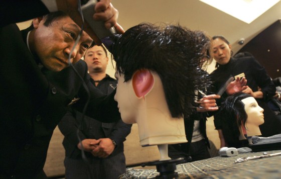 Image: students practice styling hairon mannequins