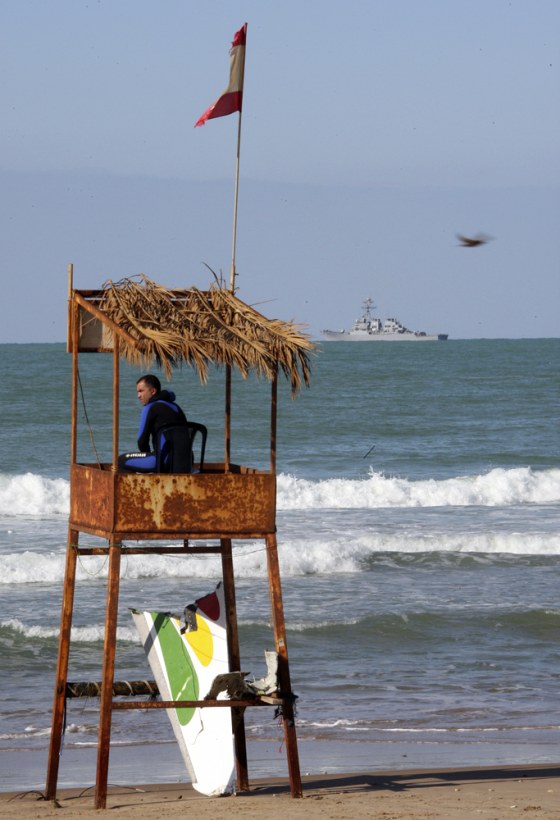 Image: Searching for debris at a beach in Beirut