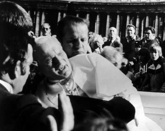 Pope John Paul II grimaces after being shot by a would-be assassin on May 13, 1981. 