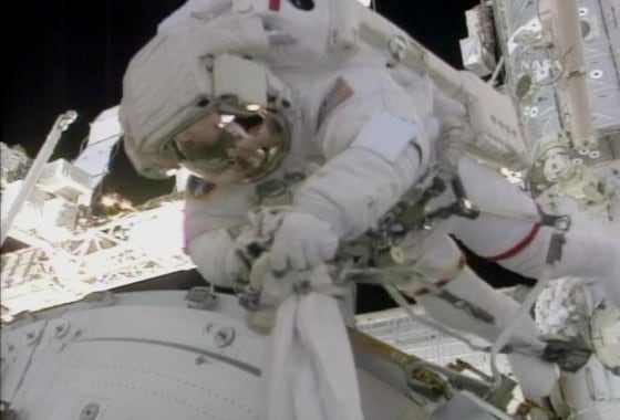 Spacewalker Robert Behnken assists with the installation of the Tranquility module on the International Space Station on Thursday.
