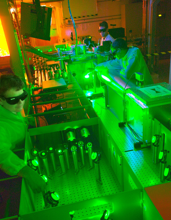 In this 2010 photo, Berkeley Lab researchers work on a 40-terawatt laser that could help blaze a trail for a new breed of particle accelerator.