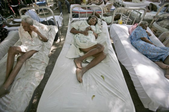 Image: Elderly patients sit outside a nursing home in Port-au-Prince