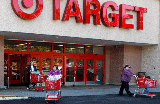 Image: Shoppers exit a Target store with their purchases in Fairfax
