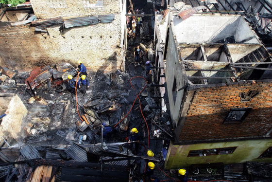 Image: A house which burnt down following a fire caused by an electrical fault after a powerful quake hit Sumatra